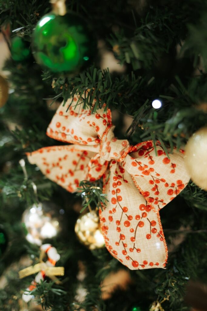 Polka-dot ribbon bow on a decorated Christmas tree