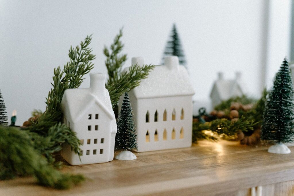 Christmas village display of white ceramic houses and little trees